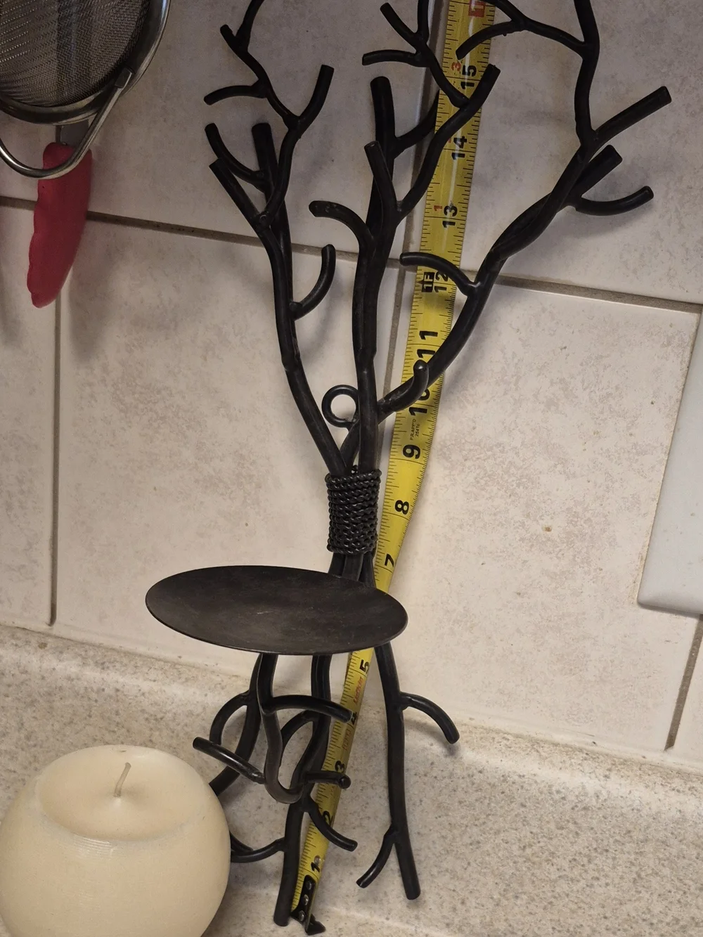 Wall-Mounted Brown Metal Branch Sconce with Cream Candle Holder. Its 17